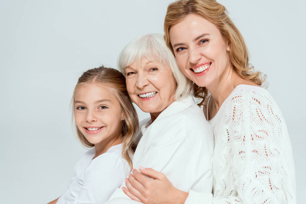 A mother and daughter are exploring various wig options together, showcasing a selection of natural-looking wigs for alopecia, including both human hair wigs and synthetic wigs. The image highlights the special considerations for women and children dealing with hair loss, emphasizing styles that can help boost confidence and self-esteem.